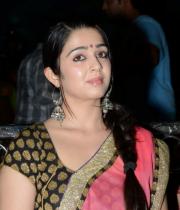 charmi-saree-stills-at-potugadu-audio-launch-11