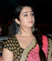 charmi-saree-stills-at-potugadu-audio-launch-12