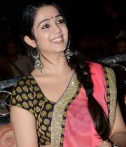 charmi-saree-stills-at-potugadu-audio-launch-16
