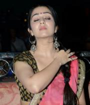 charmi-saree-stills-at-potugadu-audio-launch-18