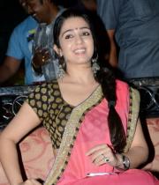 charmi-saree-stills-at-potugadu-audio-launch-2