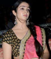 charmi-saree-stills-at-potugadu-audio-launch-20