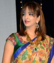 manchu-lakshmi-saree-stills-at-potugadu-audio-launch-15
