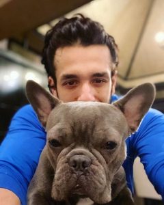 Akhil Poses With His Pet Dog Drogo Akkineni